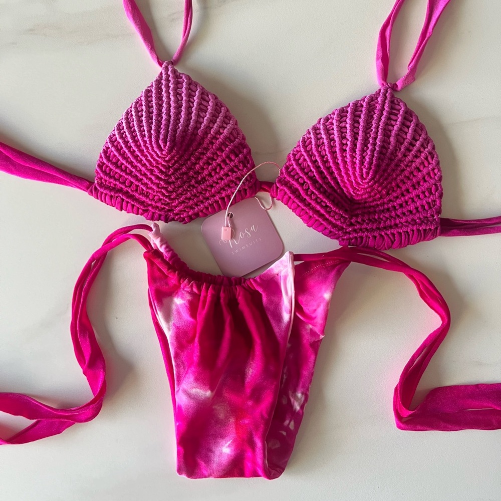 Exclusive handmade swimsuits in fuchsia and white, available in sizes S, M, L.